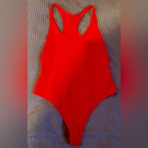 TNA large red thong bodysuit